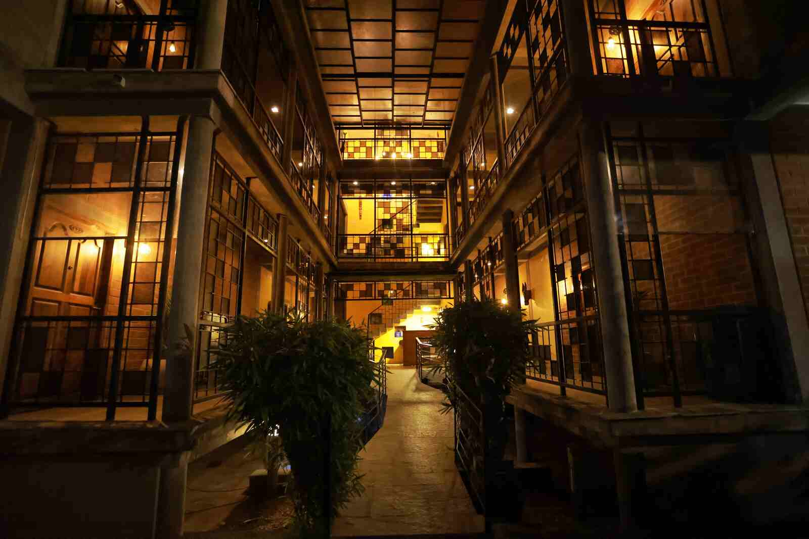 Warm lantern light fills Villa Ecotiva’s courtyard after dusk